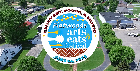 Aerial view of Flatwoods, KY with a large circular graphic overlay promoting the Flatwoods Arts & Eats Festival. The graphic includes icons of utensils and music, with the text “Enjoy Art, Foods, & Music – Flatwoods Arts & Eats Festival – June 14, 2025.”